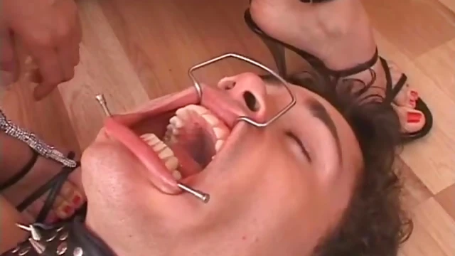 Dominant Femme Fatale Smokes While Submissive Slave Worships Her High Heels