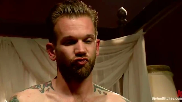 Mistress Madeline Straps on Tattooed Guy While He Gets Handjob Blissfully