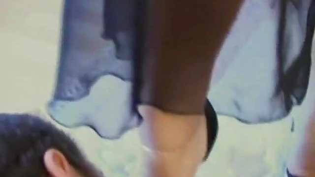 Dominant Blonde Mistress Stomps Over Slave's Chest in High Heels