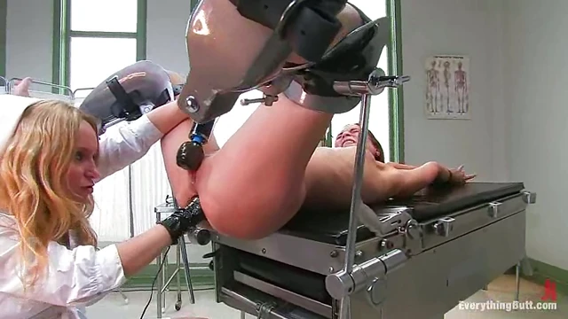 Blonde Nurse Whips Toyed Brunette Patient in Steamy Medical Play Scene