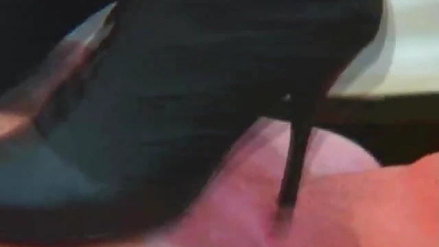 Mistress in High Heels Dominates Her Man by Trampling Him Sensually