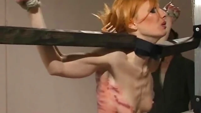 Submissive Slim Babe Screams Pleasurably Under Mistress's Stick Spanking