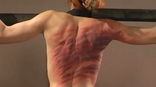 Submissive Slim Babe Screams Pleasurably Under Mistress's Stick Spanking