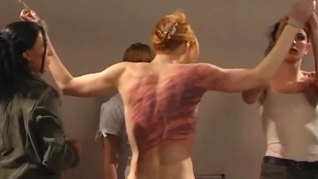 Submissive Slim Babe Screams Pleasurably Under Mistress's Stick Spanking