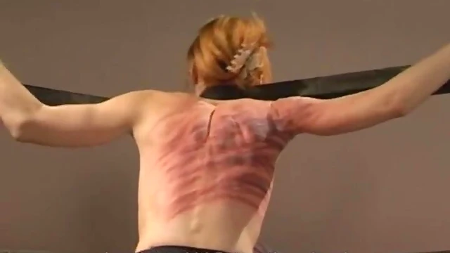 Submissive Slim Babe Screams Pleasurably Under Mistress's Stick Spanking