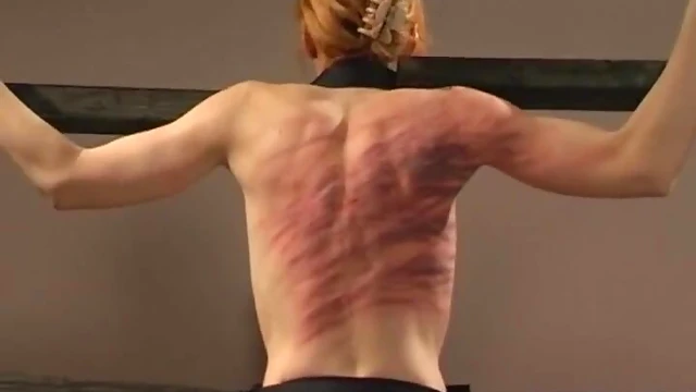 Submissive Slim Babe Screams Pleasurably Under Mistress's Stick Spanking