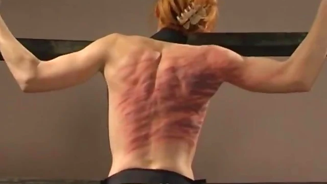 Submissive Slim Babe Screams Pleasurably Under Mistress's Stick Spanking