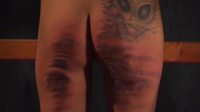 Sizzling Tattooed Babe Gets Spanked Hard by Friend's Stick Punishment