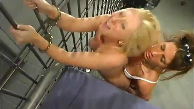 Hot Policewoman Dominates Blonde Girl with Whipping in Prison Cell
