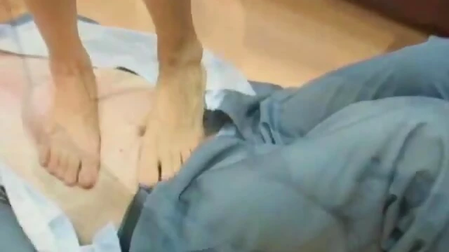 Dominant Redhead Mistress Enjoys Trampling Submissive Guy Underfoot