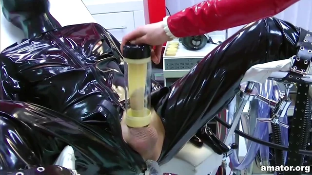 Sexy Lady Ashley in Red Latex Dominates Her Costumed Partner Hard