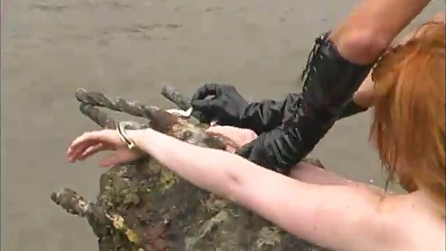 Kym Wilde Harshly Dominates Redhead Neeka by the Riverbanks Sexually