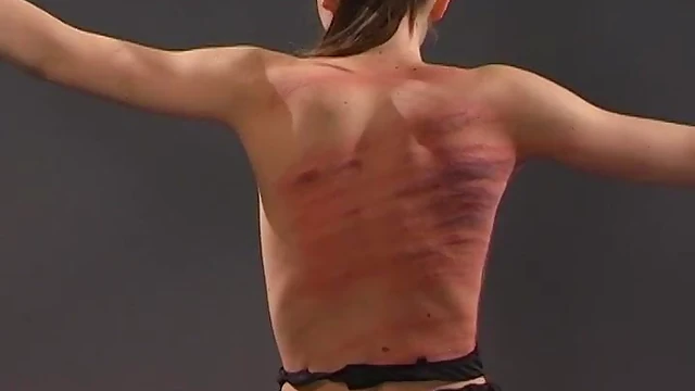 Submissive Brunette Gets Whipped On Her Back While Tied Up Seductively