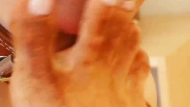 Femdom Slave Worshipfully Licks Mistress's Seductive Toes Close-Up Shoot