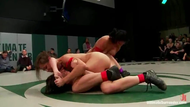 Girls Lick Each Other Passionately While Wrestling on Ring Floor