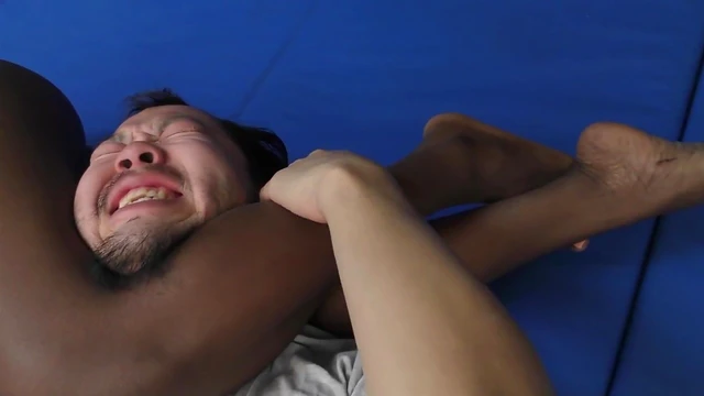 Ebony Goddess Dominates White Victim in Rough Bedtime Wrestle Match