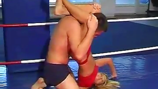 Blonde Temptress in Red Lingerie Teases & Pleasures Him in Ring Seduction