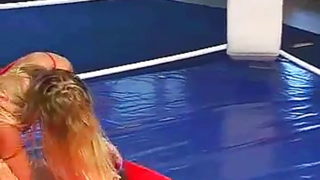 Blonde Temptress in Red Lingerie Teases & Pleasures Him in Ring Seduction