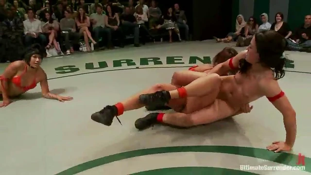 Sizzling Brunettes Wrestle Ring-Side While Teasing Each Other's Bodies