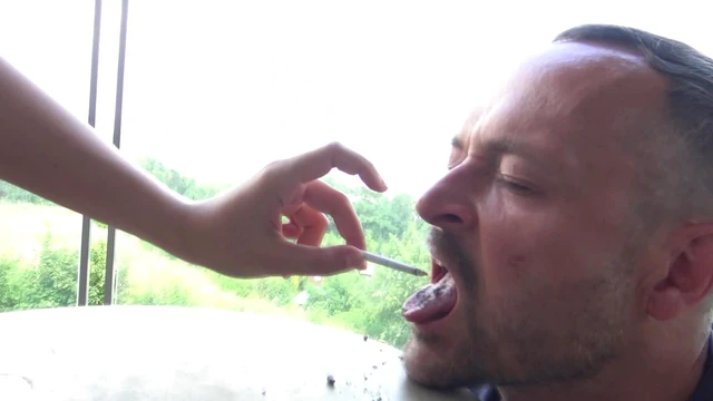 Human Ashtray Submits Fully, Devouring Cigarette Butts Intensely