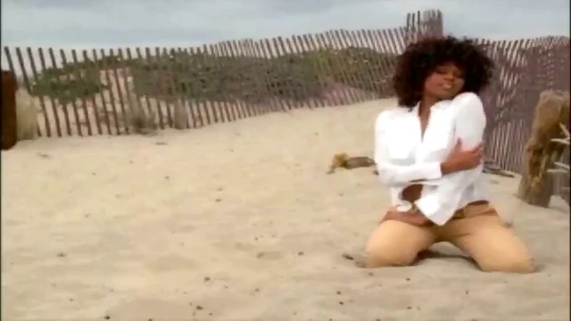 Seductive ebony babe Qiana Chase enjoys intimate beachside pleasures.