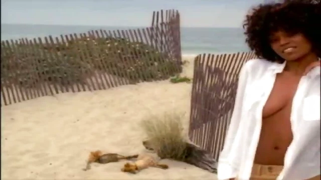 Seductive ebony babe Qiana Chase enjoys intimate beachside pleasures.