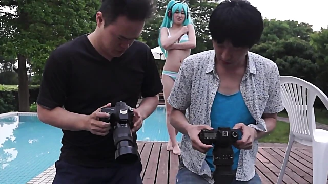 Blue-Haired Japanese Cosplayer Blows Two Guys Simultaneously In Hot Action