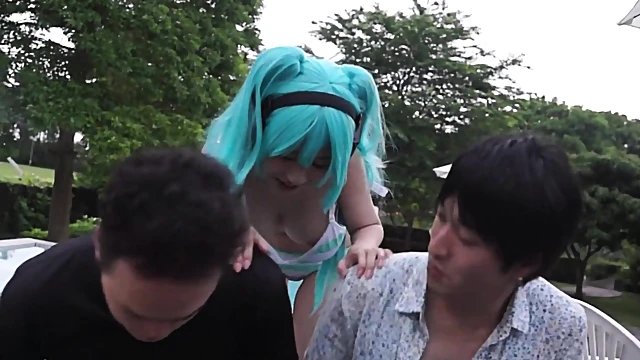 Blue-Haired Japanese Cosplayer Blows Two Guys Simultaneously In Hot Action
