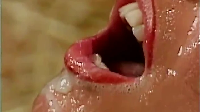 Hot Brunette Pornstar Gets Her Face Slathered in Cum During Wild Bukkake Bash