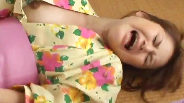 Asian Beauties on Floor Blissfully Using Vibrators Together