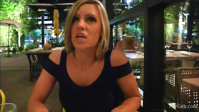 Blonde Bombshell Flashes Her Assets Publicly Before Stripping Seductively in Cafe