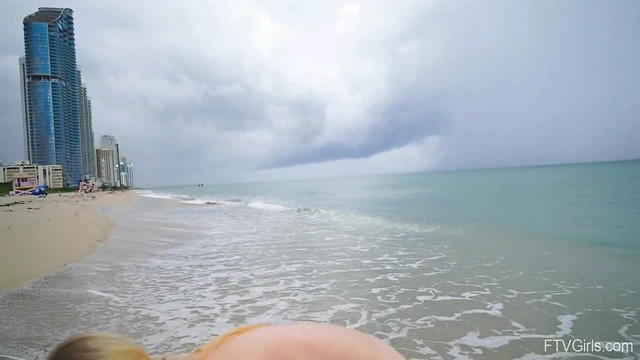 Dixie's Natural Tits Temptingly Bared While Playing Naked at Public Beach