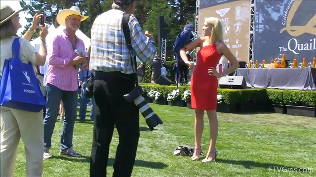 Sultry Solo Model Teases in High Heels Amidst Outdoor Car Show