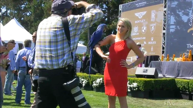 Sultry Solo Model Teases in High Heels Amidst Outdoor Car Show