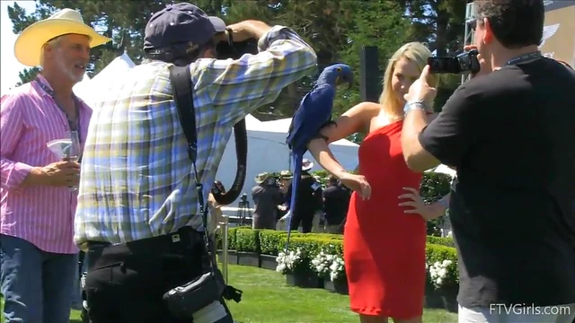 Sultry Solo Model Teases in High Heels Amidst Outdoor Car Show