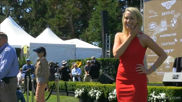 Sultry Solo Model Teases in High Heels Amidst Outdoor Car Show