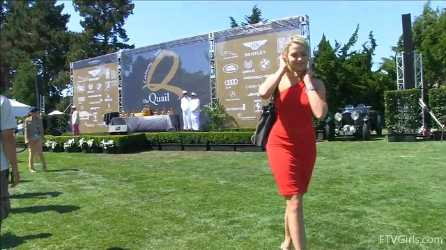 Sultry Solo Model Teases in High Heels Amidst Outdoor Car Show