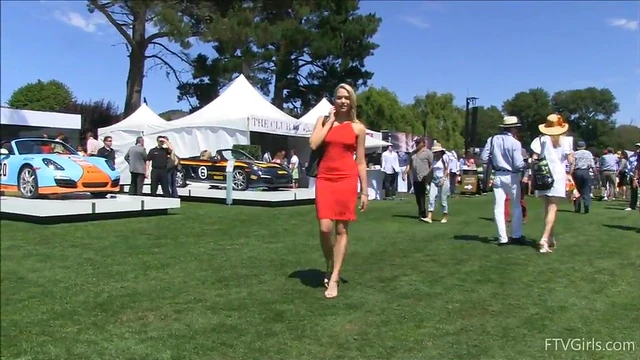 Sultry Solo Model Teases in High Heels Amidst Outdoor Car Show