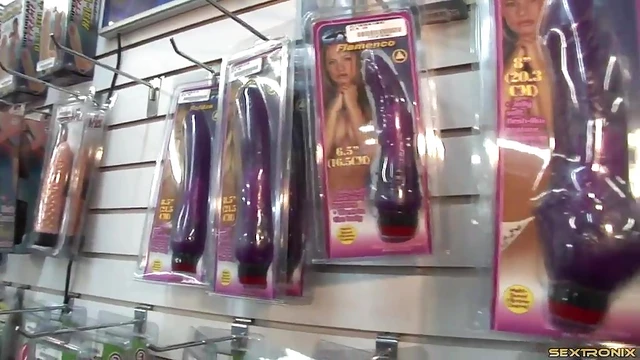 Seductive Girl Explores Her Pleasure Box With Dildo in Porn Store Setting
