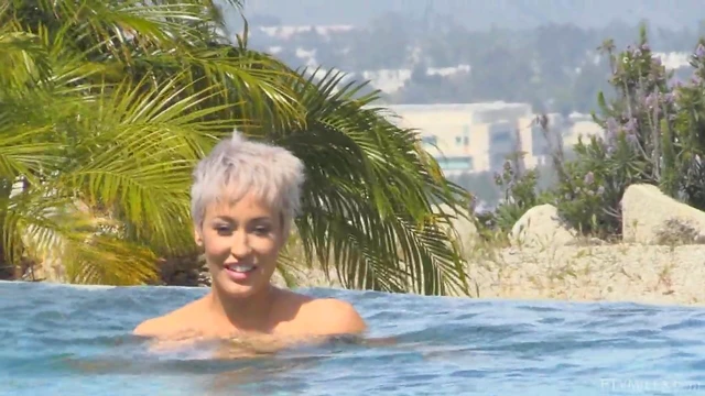 Ryan Strips By The Pool Exposing Her Shaved MILF Pussy Publicly