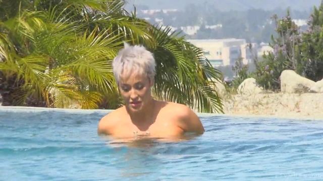 Ryan Strips By The Pool Exposing Her Shaved MILF Pussy Publicly