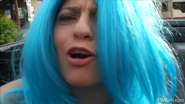 Seductive Stacey in Blue Wig Strips Teasingly By The Poolside