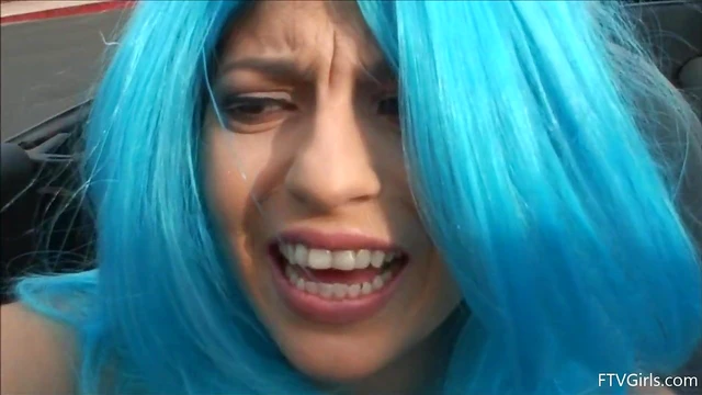 Seductive Stacey in Blue Wig Strips Teasingly By The Poolside