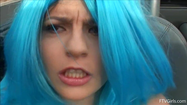 Seductive Stacey in Blue Wig Strips Teasingly By The Poolside