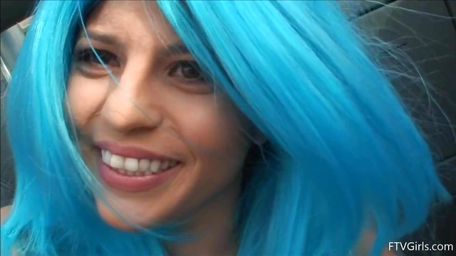 Seductive Stacey in Blue Wig Strips Teasingly By The Poolside