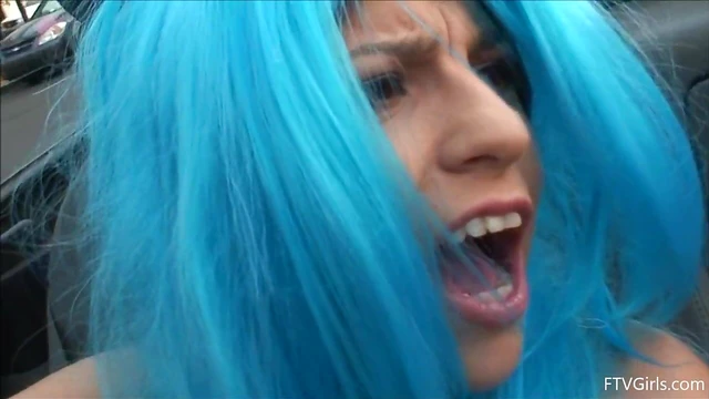 Seductive Stacey in Blue Wig Strips Teasingly By The Poolside