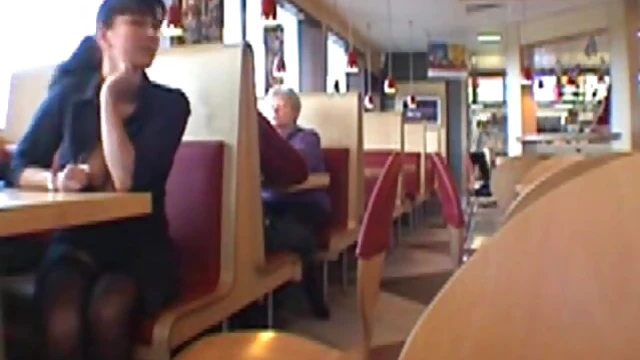 Sexy Brunette Shows Off Her Boobs at Busy Restaurant Table