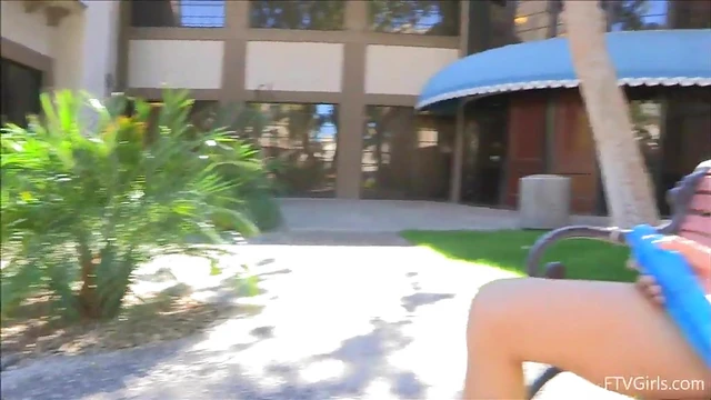 Petite Asian Doll Teases Her Smooth Pussy While Sitting Barely Clothed