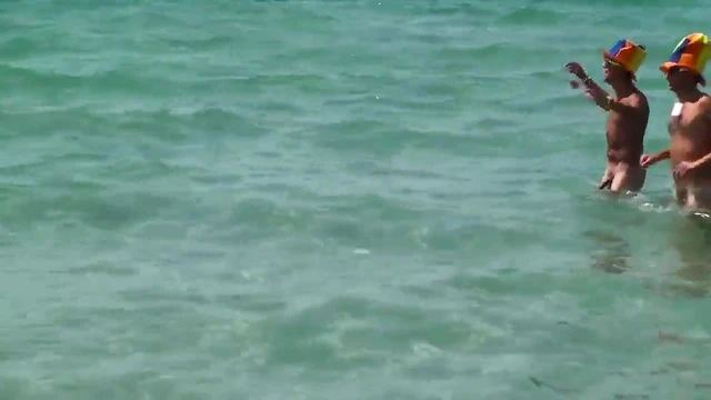 Young Girl Enjoys Beach Party With Sexy Guys In The Sunlight