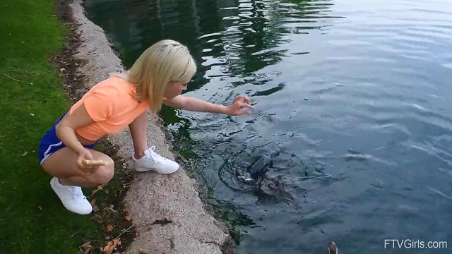 Outdoor Temptation: Flexible Blonde Kiara Teasingly Spreads Her Legs